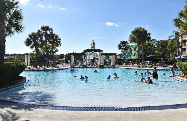 2778 Almaton Loop Unit 403, Kissimmee, FL 34747 - community pool featuring a patio