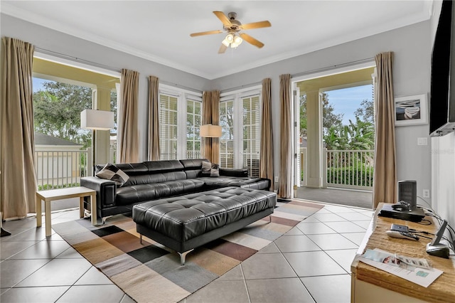 1501 Northern Harrier Way Unit 101, Kissimmee, FL 34747 - living area featuring crown molding, a ceiling fan, and tile patterned floors