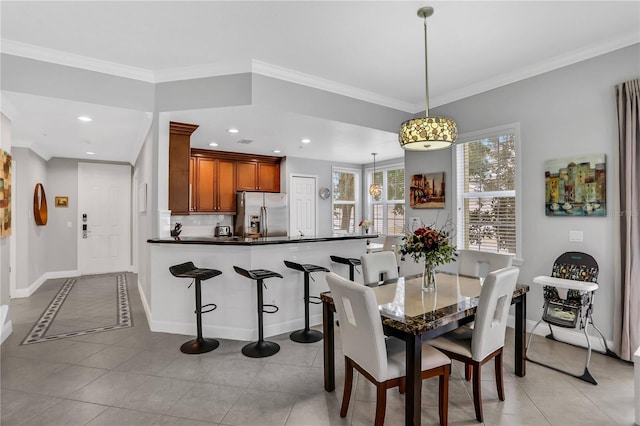 1501 Northern Harrier Way Unit 101, Kissimmee, FL 34747 - dining room featuring crown molding, recessed lighting, baseboards, and light tile patterned floors