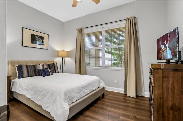 1501 Northern Harrier Way Unit 101, Kissimmee, FL 34747 - bedroom featuring dark wood-type flooring, baseboards, and ceiling fan