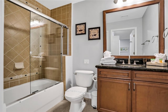 1501 Northern Harrier Way Unit 101, Kissimmee, FL 34747 - full bath with visible vents, tile patterned flooring, vanity, toilet, and bath / shower combo with glass door