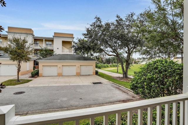 1501 Northern Harrier Way Unit 101, Kissimmee, FL 34747 - view of front of home with roof with shingles and stucco siding
