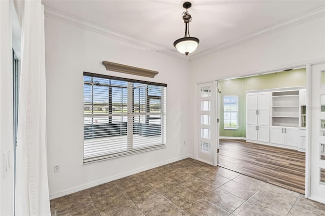 759 Glendora Rd, Kissimmee, FL 34759 - foyer featuring plenty of natural light, crown molding, tile patterned floors, and baseboards