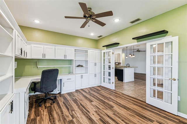 759 Glendora Rd, Kissimmee, FL 34759 - office space featuring french doors, dark wood-style floors, built in study area, ceiling fan, and recessed lighting