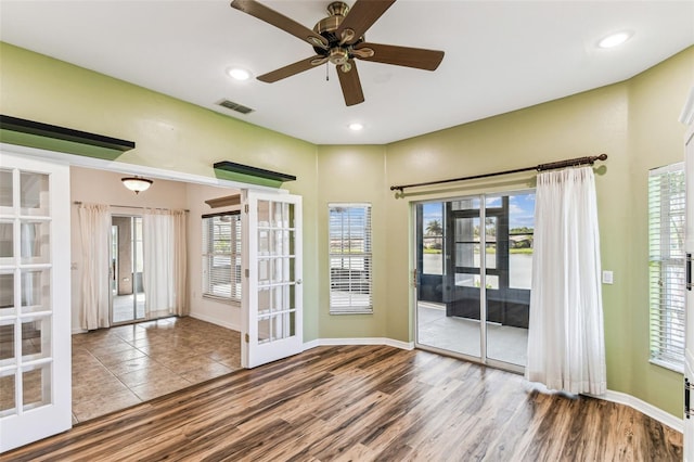 759 Glendora Rd, Kissimmee, FL 34759 - spare room with french doors, wood finished floors, healthy amount of natural light, and recessed lighting