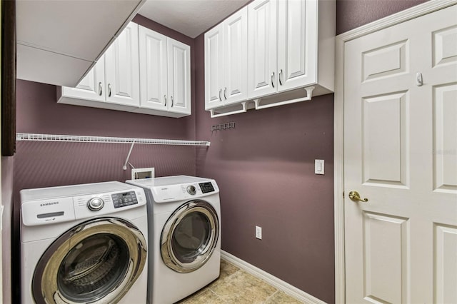 759 Glendora Rd, Kissimmee, FL 34759 - laundry area featuring cabinet space, washer and clothes dryer, baseboards, and tile patterned floors