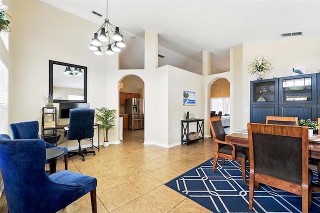 interior space with an inviting chandelier, arched walkways, light tile patterned flooring, and visible vents