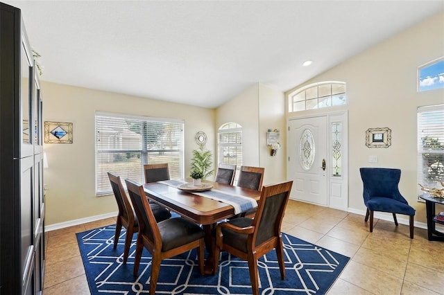 dining area featuring baseboards, recessed lighting, light tile patterned floors, and high vaulted ceiling