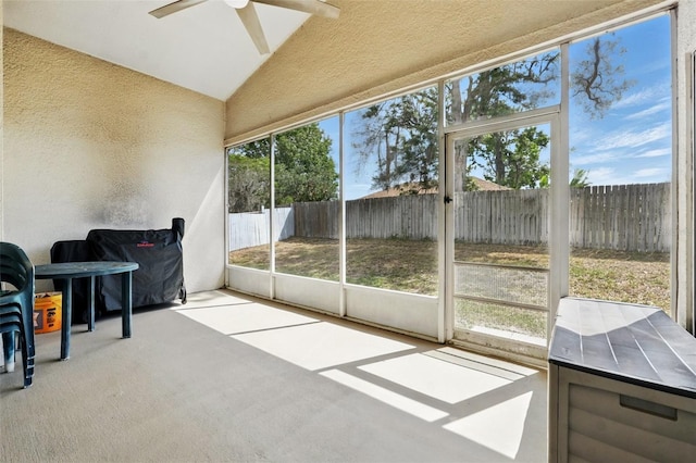 sunroom / solarium featuring ceiling fan
