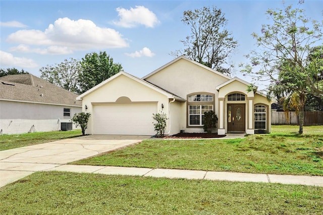 ranch-style house with a garage, a front lawn, fence, stucco siding, and driveway