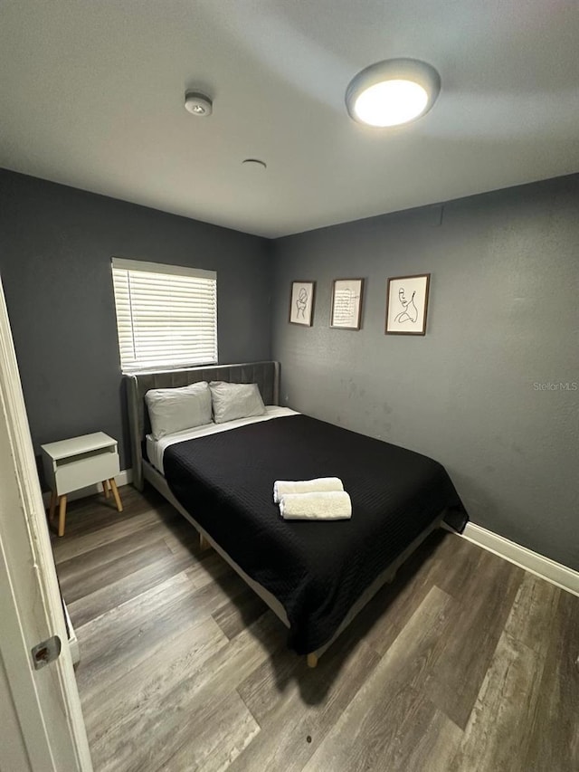 8702 El Portal Dr, Tampa, FL 33604 - bedroom with wood finished floors and baseboards