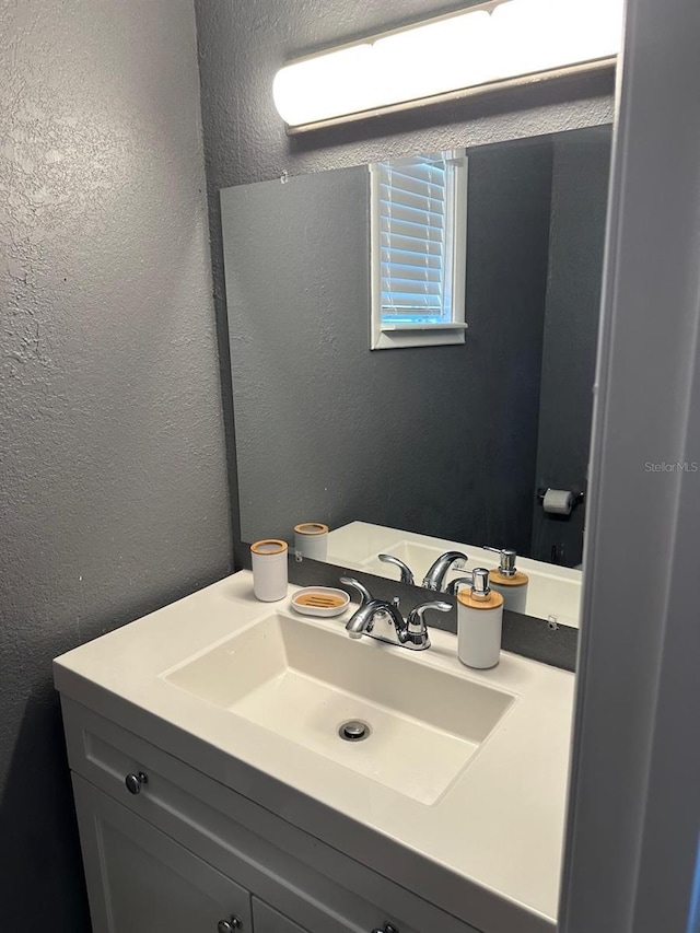 8702 El Portal Dr, Tampa, FL 33604 - bathroom with a textured wall and vanity