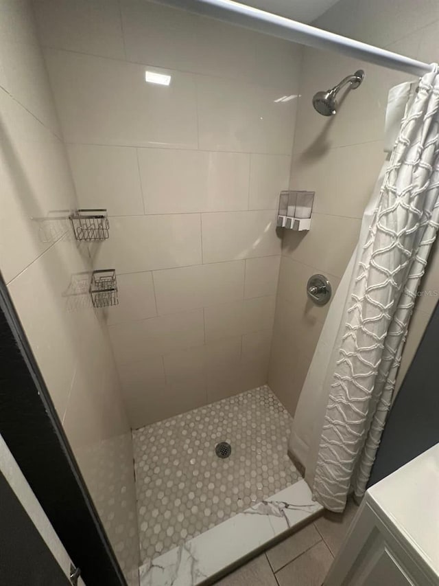 8702 El Portal Dr, Tampa, FL 33604 - bathroom featuring a tile shower