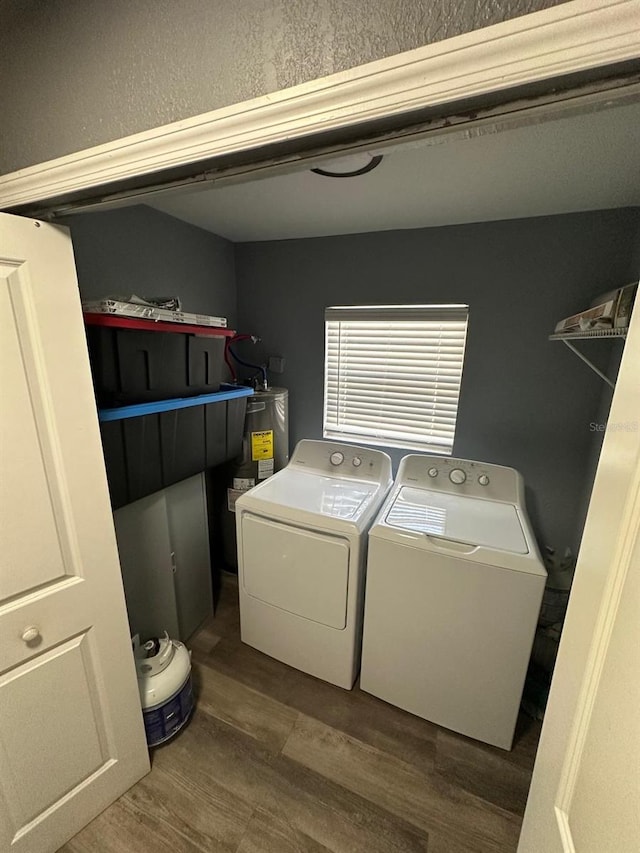 8702 El Portal Dr, Tampa, FL 33604 - laundry room featuring washing machine and dryer and water heater
