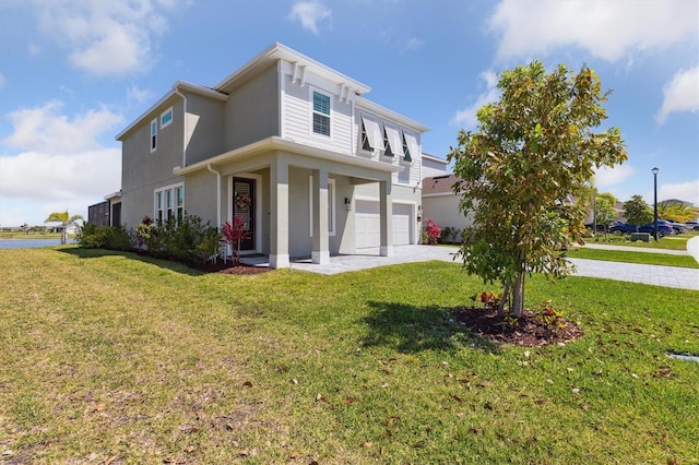 2476 Kamin Dr, Melbourne, FL 32940 - view of front facade featuring a garage, stucco siding, a front yard, and concrete driveway
