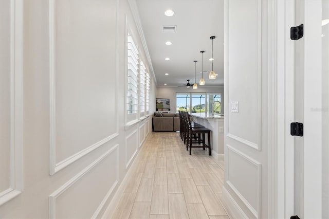 2476 Kamin Dr, Melbourne, FL 32940 - hallway featuring visible vents, recessed lighting, and light wood-style flooring