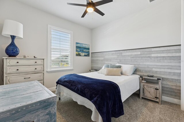 2476 Kamin Dr, Melbourne, FL 32940 - bedroom with baseboards, ceiling fan, and light carpet