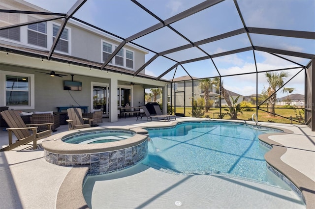 2476 Kamin Dr, Melbourne, FL 32940 - view of swimming pool with a lanai, a ceiling fan, a pool with connected hot tub, a patio area, and an outdoor hangout area