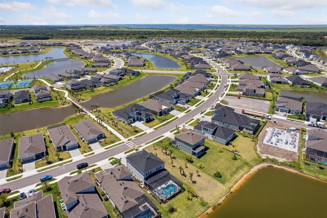 2476 Kamin Dr, Melbourne, FL 32940 - aerial view with a residential view and a water view