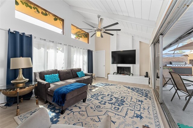 5053 Maui Cir Unit 14, Orlando, FL 32808 - living area featuring wood finished floors, beam ceiling, high vaulted ceiling, wood ceiling, and a ceiling fan