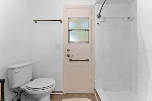 5053 Maui Cir Unit 14, Orlando, FL 32808 - full bathroom with wood finished floors, toilet, and a shower stall