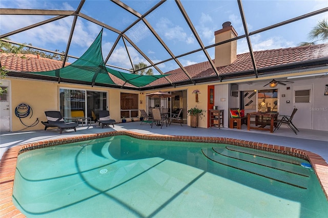 5053 Maui Cir Unit 14, Orlando, FL 32808 - pool with outdoor dining space, ceiling fan, glass enclosure, and a patio