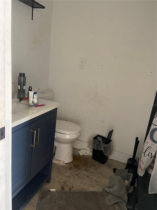 225 Ronnie Cir, Orlando, FL 32811 - bathroom featuring toilet, vanity, and unfinished concrete flooring