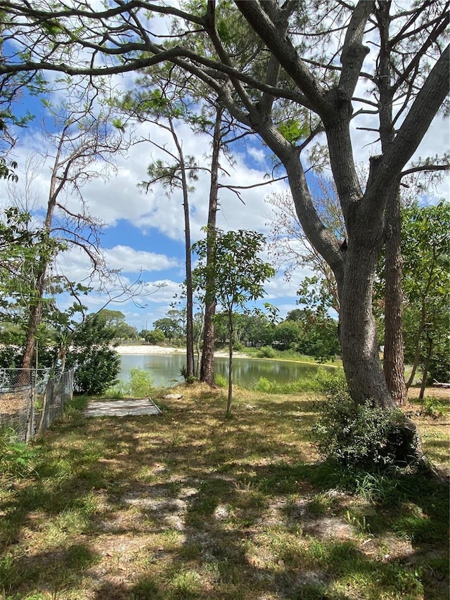225 Ronnie Cir, Orlando, FL 32811 - view of yard featuring a water view and fence