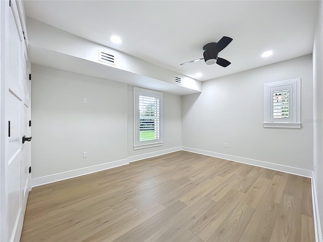 spare room with light wood-style floors, a ceiling fan, baseboards, recessed lighting, and visible vents