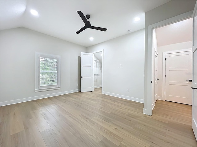 unfurnished bedroom with ceiling fan, vaulted ceiling, baseboards, light wood finished floors, and recessed lighting