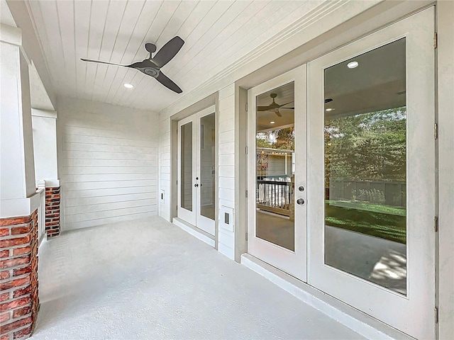 unfurnished sunroom featuring french doors and a ceiling fan