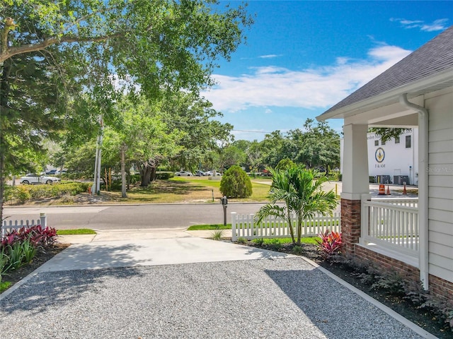 exterior space featuring concrete driveway