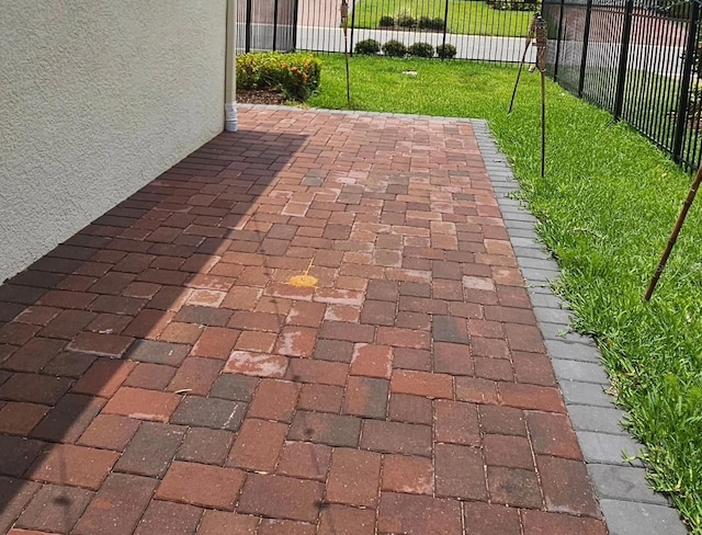 view of patio / terrace featuring fence