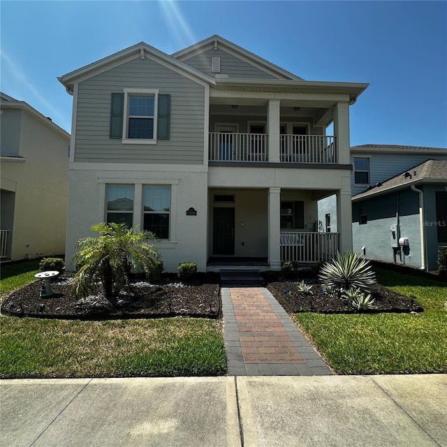 15929 Moonlight Bay St, Winter Garden, FL 34787 - view of front of property featuring a balcony, covered porch, and stucco siding