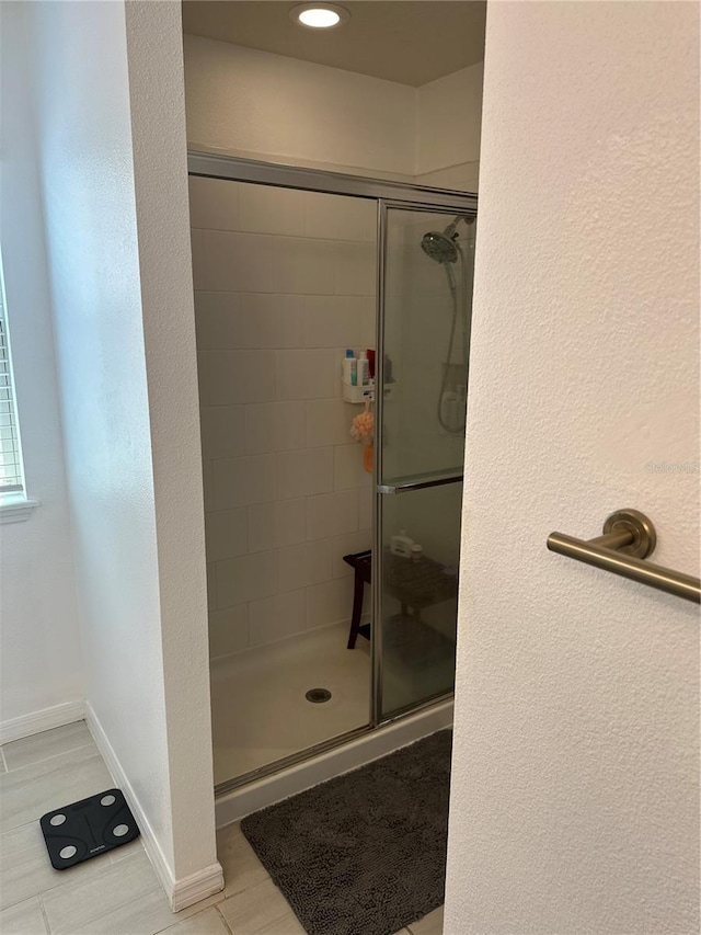 15929 Moonlight Bay St, Winter Garden, FL 34787 - bathroom featuring a shower stall and tile patterned flooring