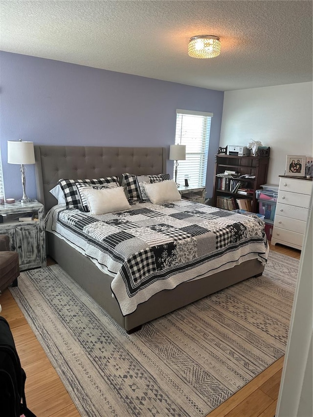 15929 Moonlight Bay St, Winter Garden, FL 34787 - bedroom with wood finished floors and a textured ceiling