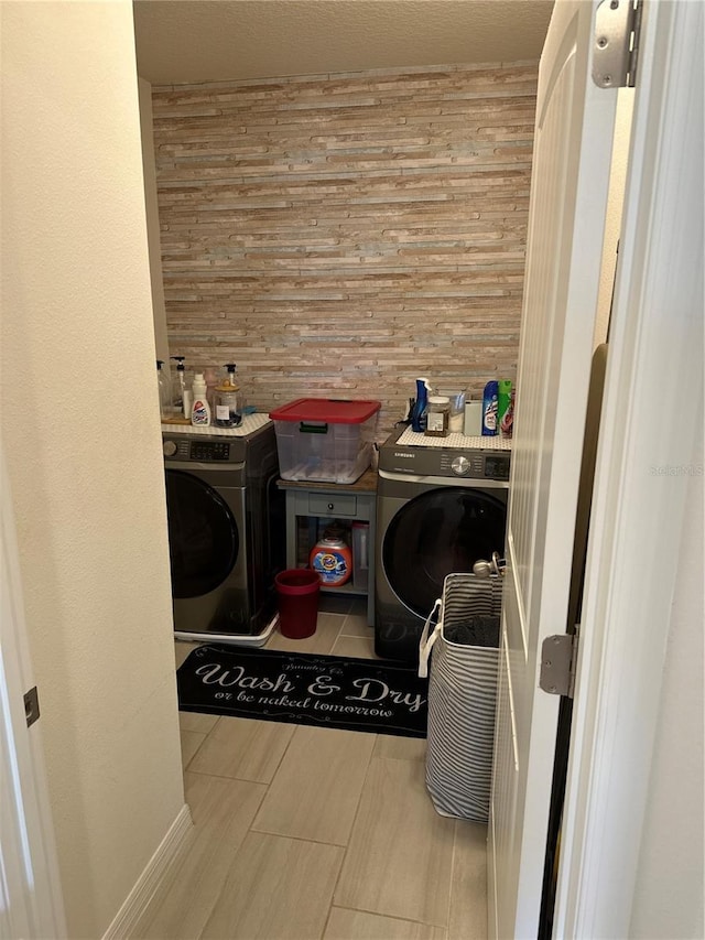 15929 Moonlight Bay St, Winter Garden, FL 34787 - laundry room with wooden walls and independent washer and dryer