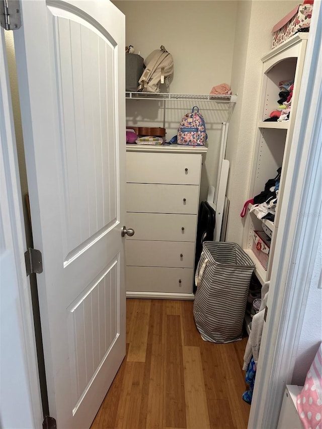 15929 Moonlight Bay St, Winter Garden, FL 34787 - walk in closet featuring wood finished floors