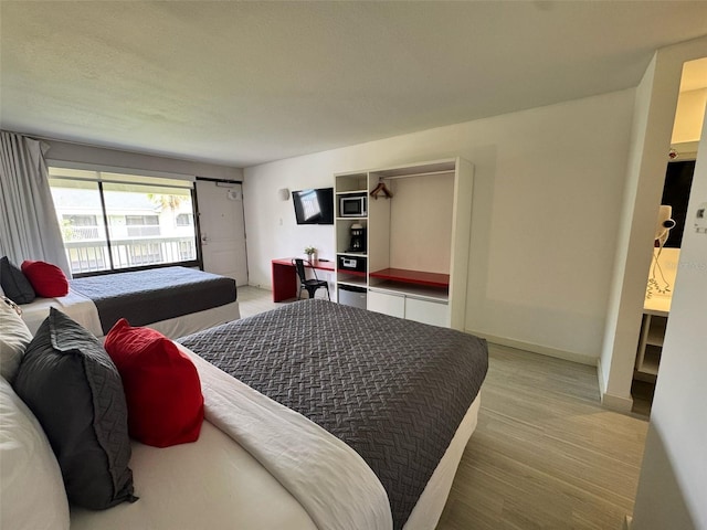 5245 W Irlo Bronson Memorial Hwy Unit 276, Kissimmee, FL 34746 - bedroom featuring light wood-style flooring