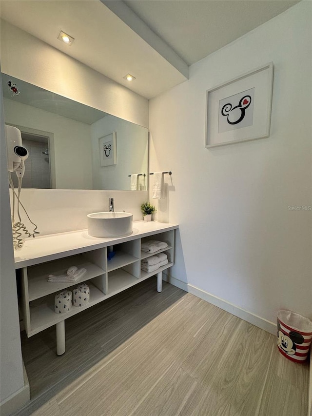 5245 W Irlo Bronson Memorial Hwy Unit 276, Kissimmee, FL 34746 - bathroom with baseboards, vanity, and wood finished floors
