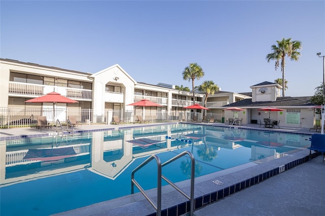 5245 W Irlo Bronson Memorial Hwy Unit 276, Kissimmee, FL 34746 - community pool with a patio and fence