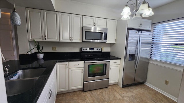 3235 Candle Ridge Dr Unit 102, Orlando, FL 32822 - kitchen with a sink, white cabinetry, a wealth of natural light, and stainless steel appliances