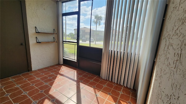 3235 Candle Ridge Dr Unit 102, Orlando, FL 32822 - doorway featuring a textured wall and a wealth of natural light