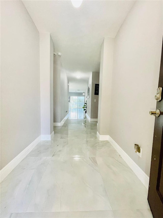 247 Whispering Pines Way, Davenport, FL 33837 - hall with baseboards and light marble finish flooring