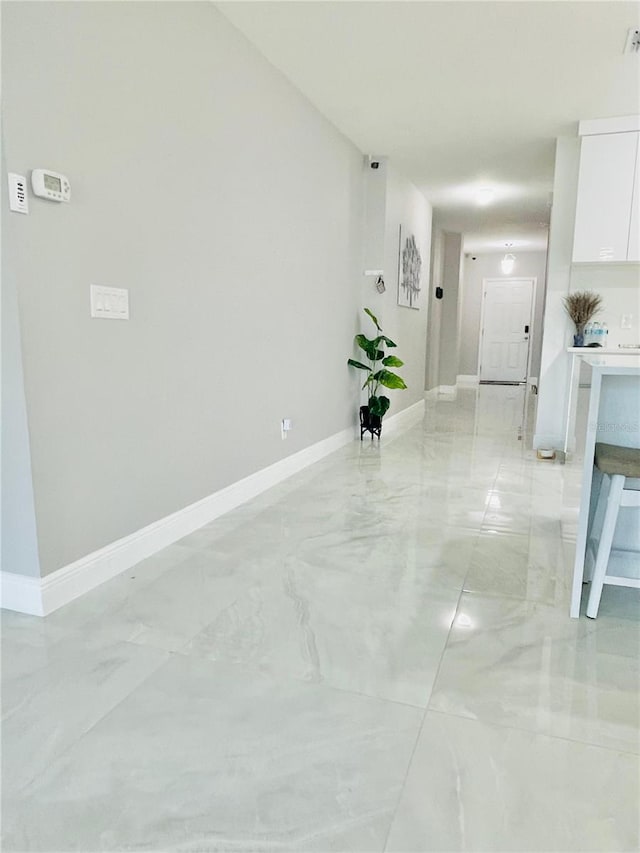 247 Whispering Pines Way, Davenport, FL 33837 - empty room with light marble finish floors and baseboards