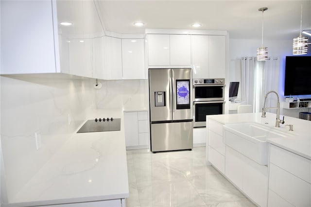 247 Whispering Pines Way, Davenport, FL 33837 - kitchen featuring appliances with stainless steel finishes, modern cabinets, a sink, white cabinets, and light marble finish floors