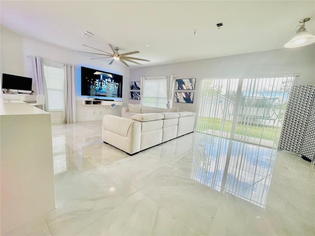 247 Whispering Pines Way, Davenport, FL 33837 - living area with ceiling fan and light tile patterned floors