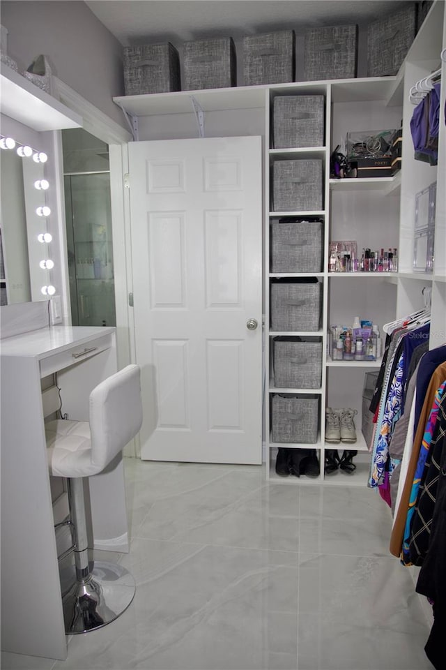 247 Whispering Pines Way, Davenport, FL 33837 - interior space featuring marble finish floors and a shower with shower door