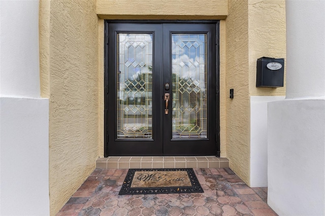 5321 Los Palma Vista Dr, Orlando, FL 32837 - entrance to property with french doors and stucco siding