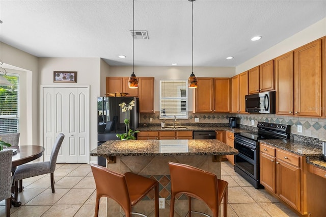 5321 Los Palma Vista Dr, Orlando, FL 32837 - kitchen with freestanding refrigerator, double oven range, a sink, and plenty of natural light